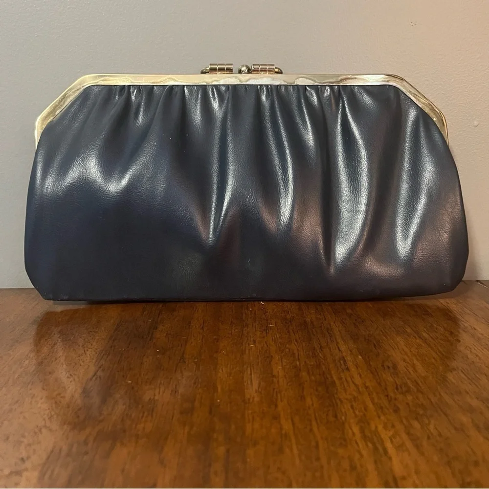 Red and Navy blue reversible vintage clutch purse with gold tone clasp.